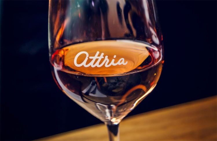 a close up of a glass of wine from attria wine bar