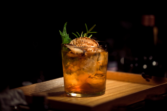 Cocktail sitting on wooden tray