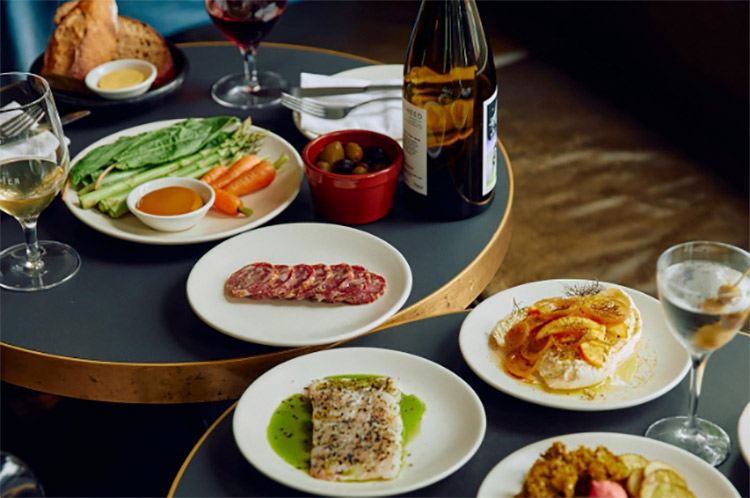 food and wine laid out on the table