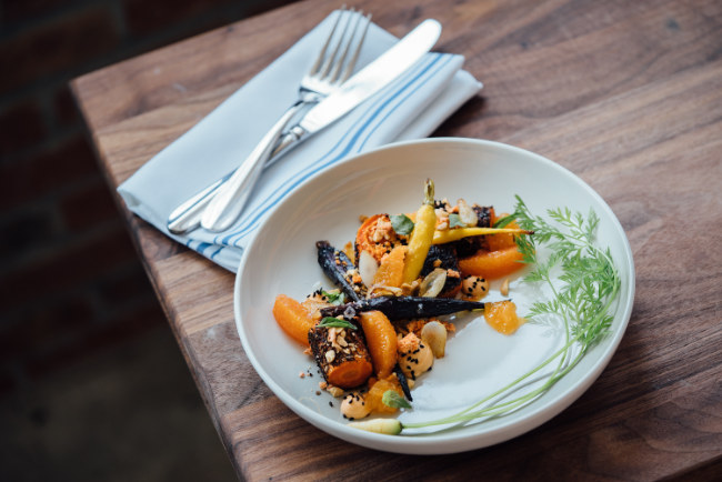 Plate of beautifully cooked vegetables with parsley garnish