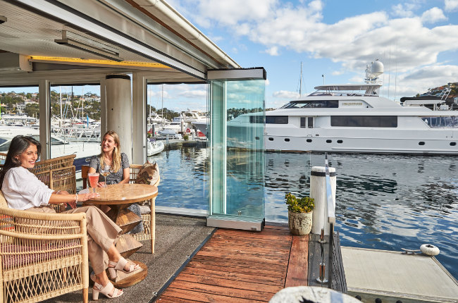 people enjoying a drink with a waterfront view
