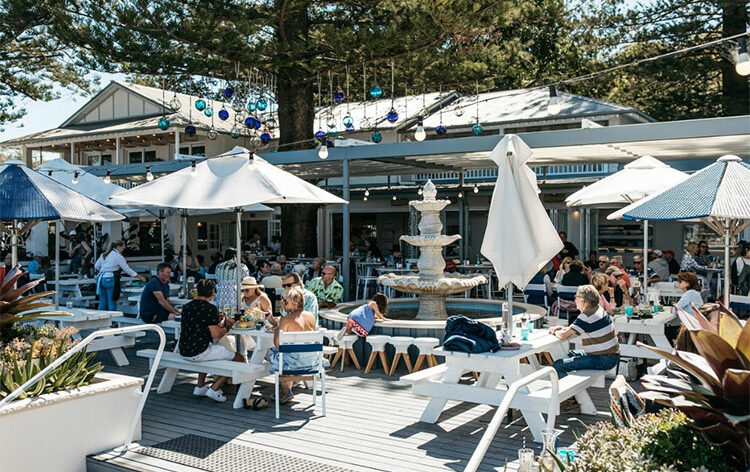 an outdoor waterfront restaurant setting in sydney at the boathouse restaurant