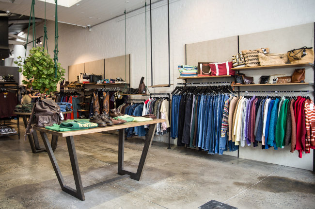 clothing on tables and on racks to be bought