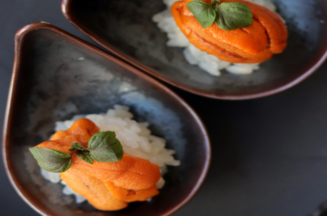 hand-made sushi prepared on a teardrop-shaped plate