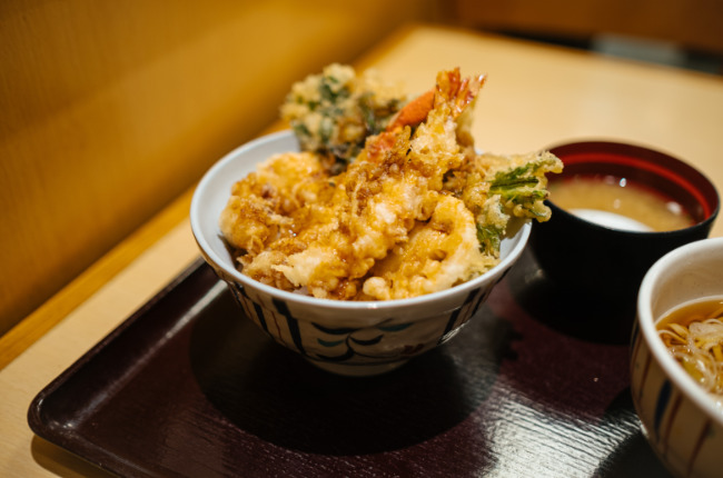 a bowl of tempura prawns and broccoli