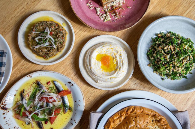 a selection of delicious dips on a table