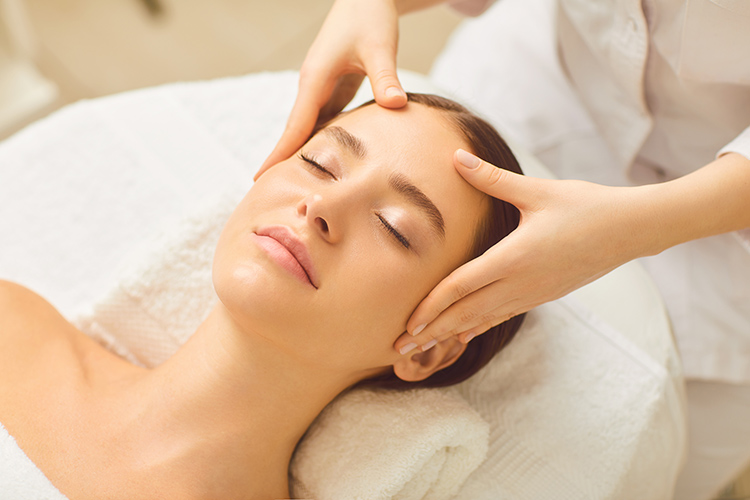 a lady receiving a facial at a massage parlour