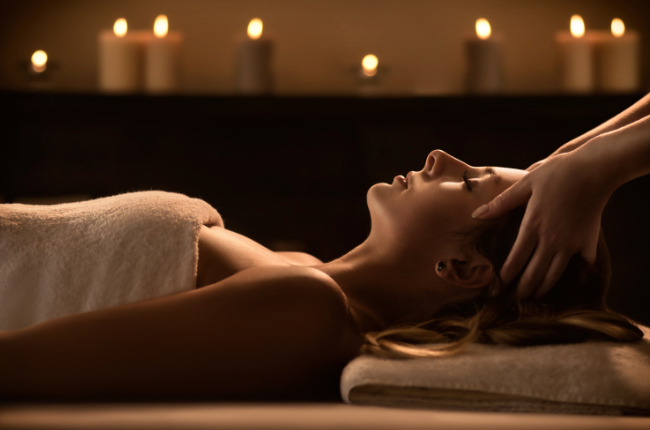 a woman getting a scalp massage