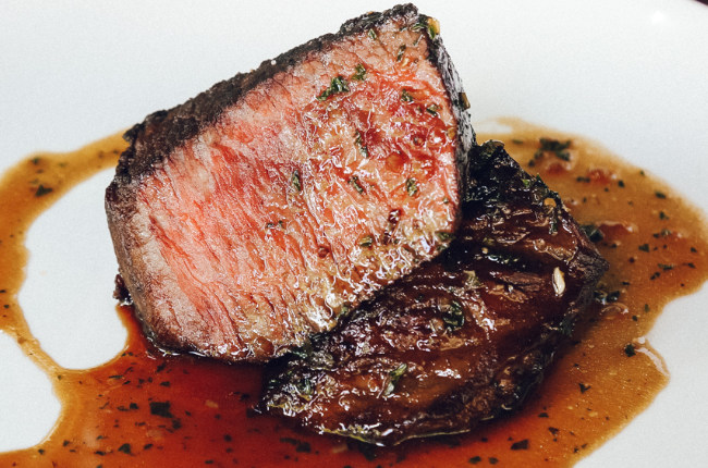 a close up shot of a ribeye steak
