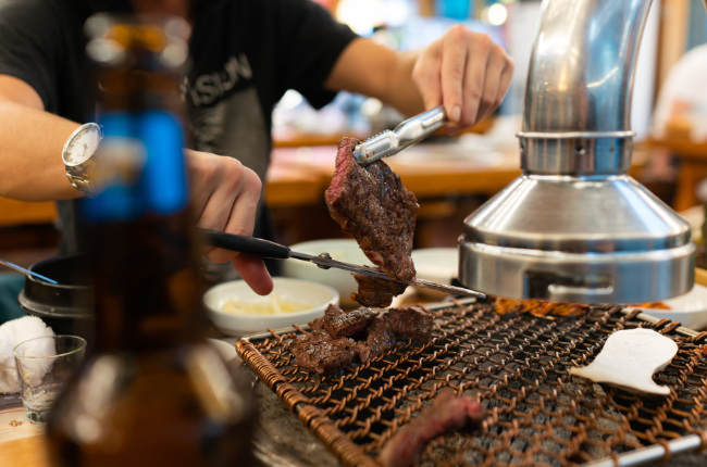 man cooking meat