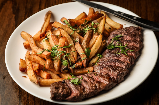 chopped up steak with fries