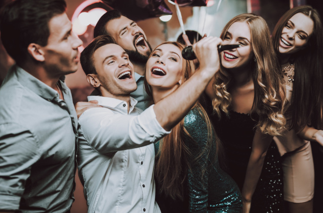 people enjoying singing