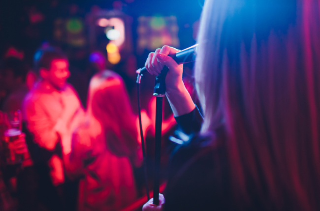 a girl singing karaoke