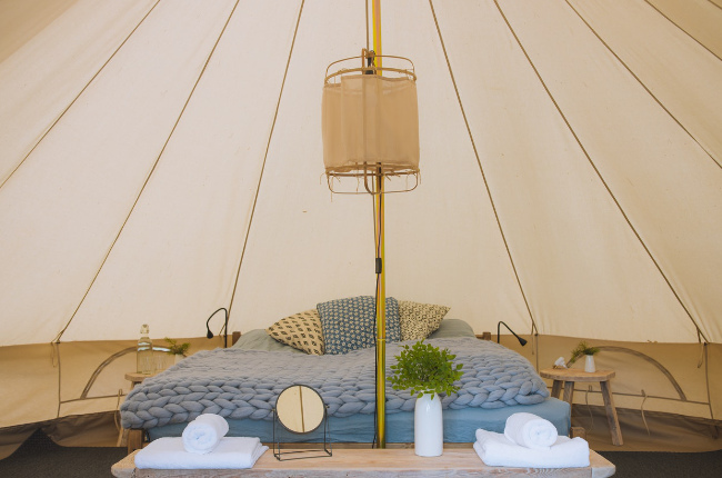 a decadent glamping tent filled with luxury