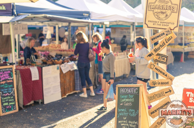 people browsing a selection of food stalls
