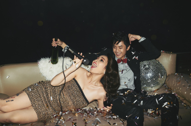 a couple having a fun time singing