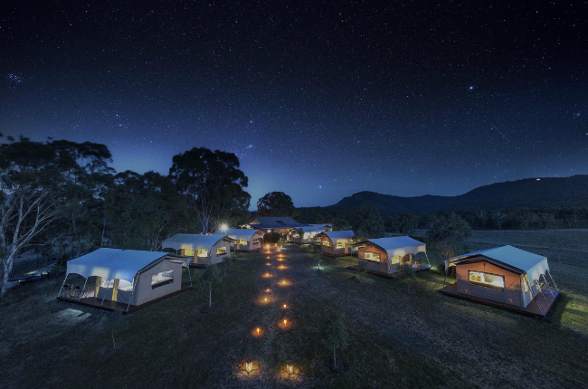 a glamping site underneath the shining night sky