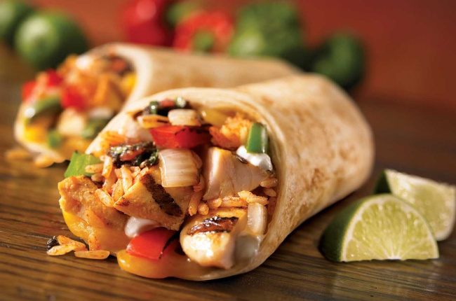 a tasty fajita filled with chicken and onion