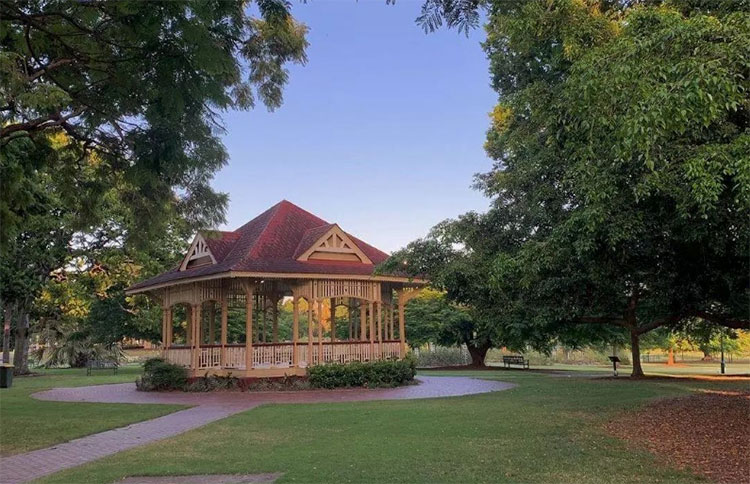 a landscape photo of a rotunda at new farm park