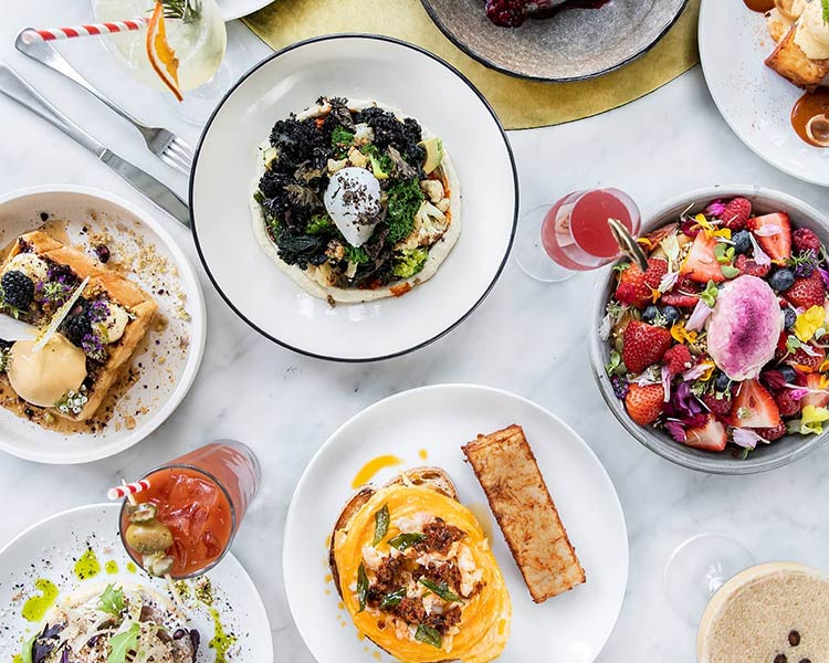 a table at kettle black cafe with a selection of brunch meals from the menu