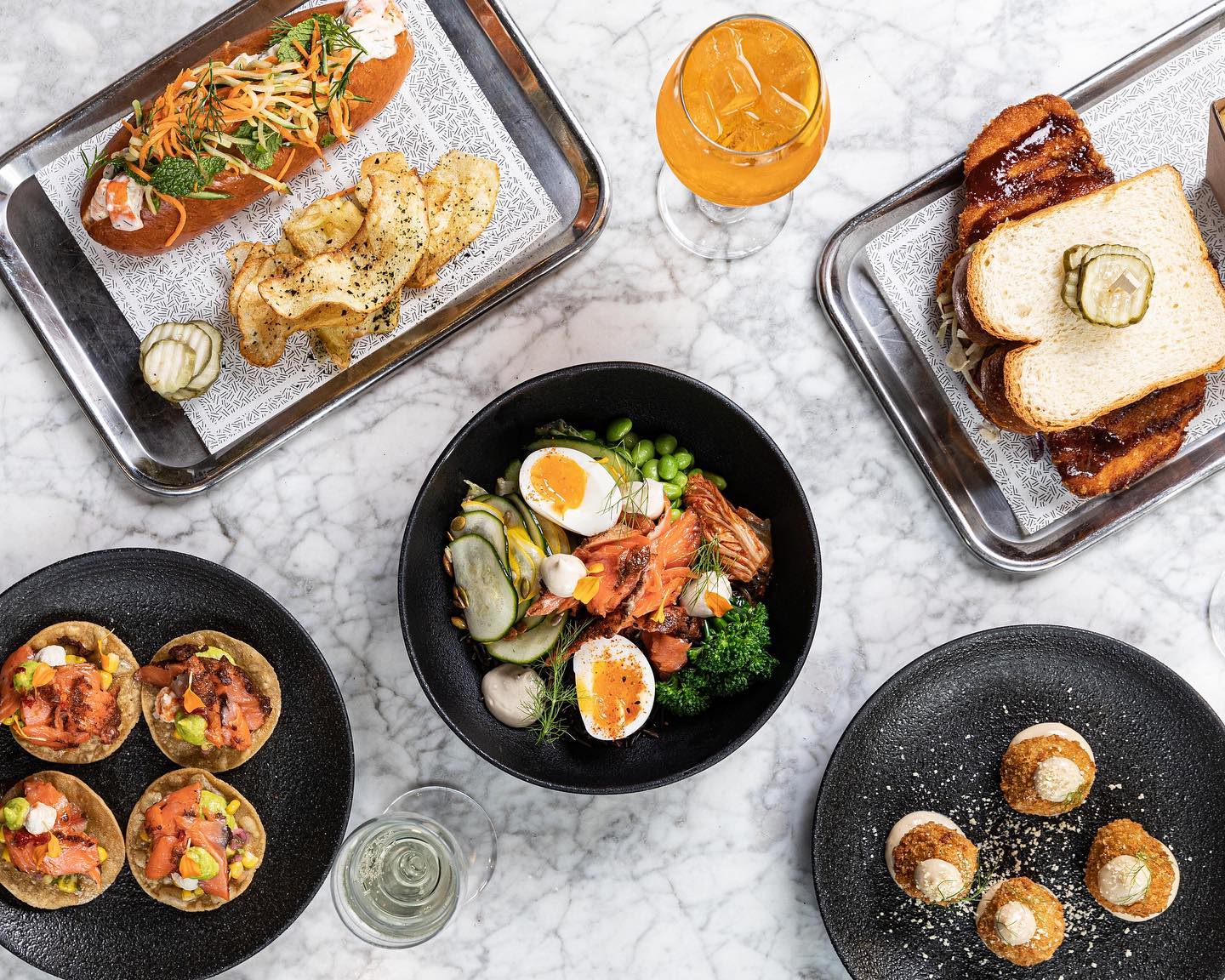 a table with a selection of brunch items from the restaurant fargo and co in melbourne
