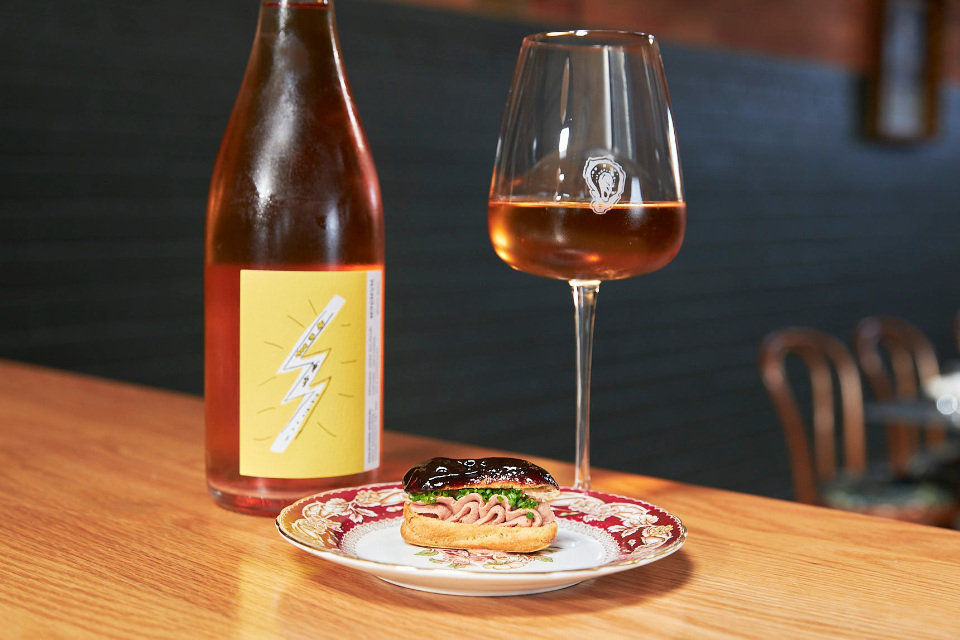 a glass and a bottle of wine from Lilac wine
