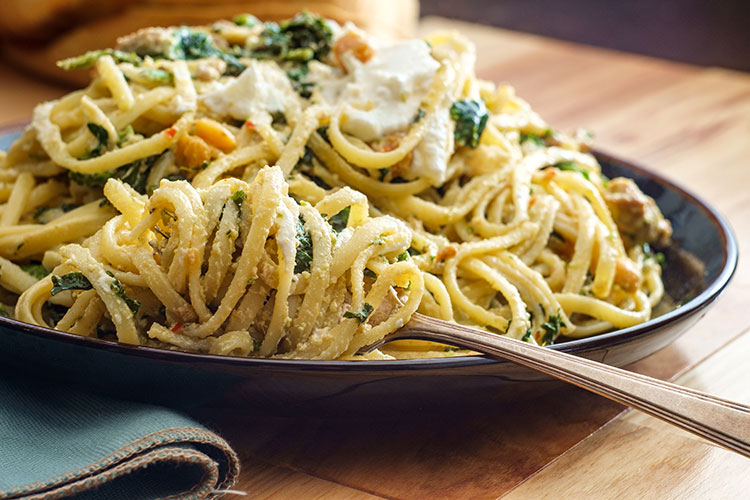 a close up photo of a bowl of linguine