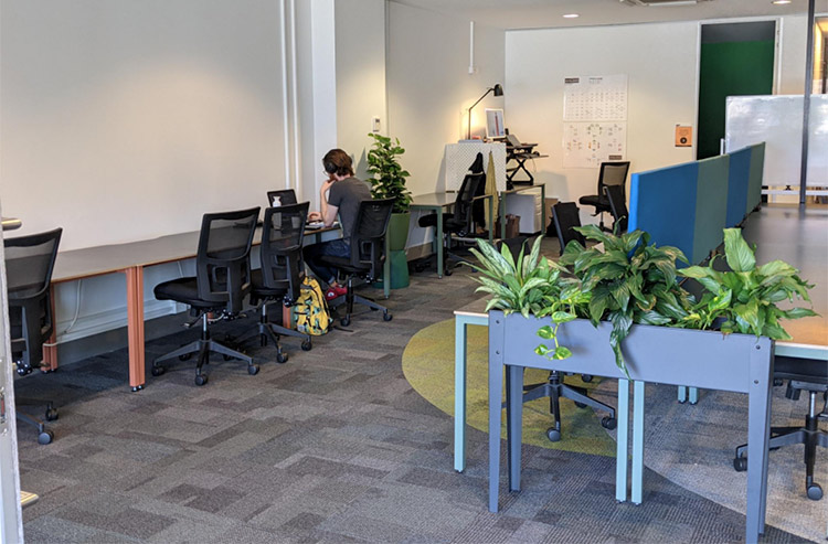 a man working away at the arcade coworking space in melbourne