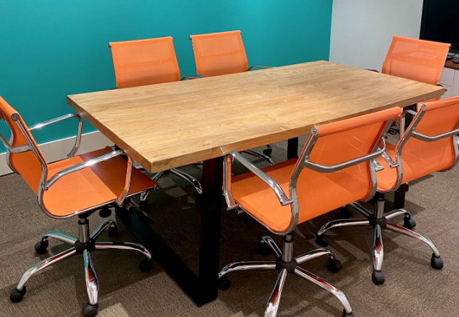 a close-up of desk and chairs at thrive network