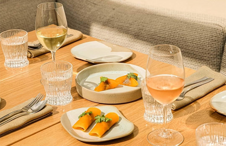 light meals sitting on a table with wine